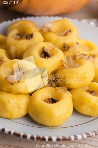 Image of Polish noodles ( kluski slaskie ) with potatoe and pumpkin