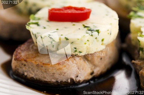 Image of steak with herbs butter