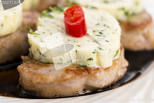 Image of steak with herbs butter