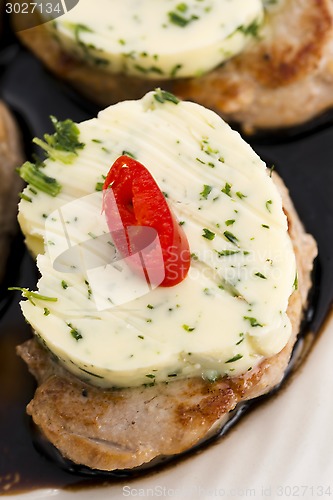 Image of steak with herbs butter