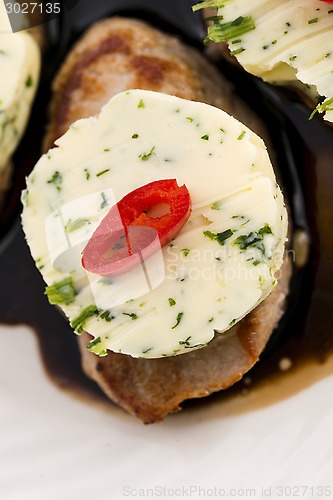 Image of steak with herbs butter