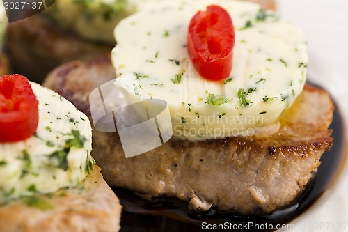 Image of steak with herbs butter