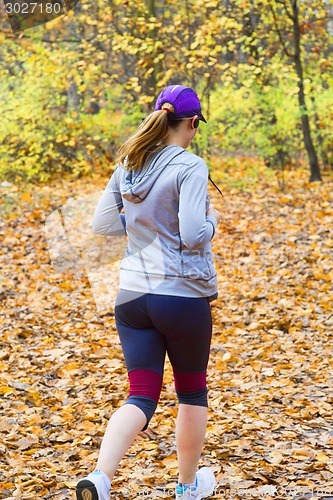 Image of Female jogger in   park