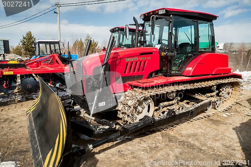 Image of Plow tractor demonstration of Belarus production