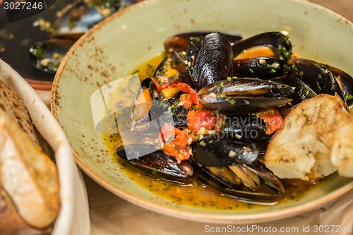 Image of Moules Marinieres - Mussels cooked with white wine sauce.