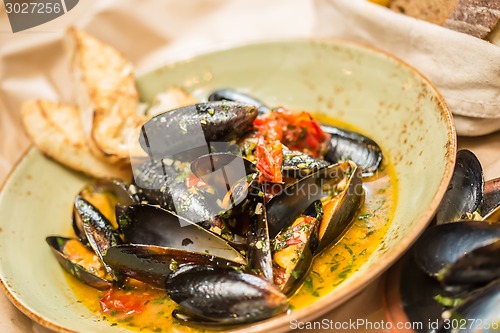 Image of Moules Marinieres - Mussels cooked with white wine sauce.