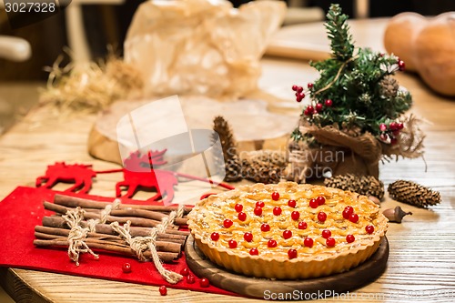 Image of Homemade christmas cake with wild berries.