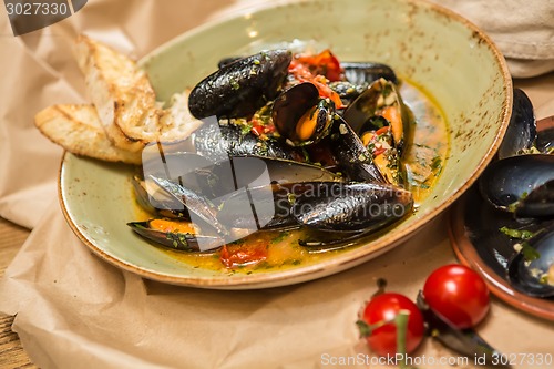 Image of Moules Marinieres - Mussels cooked with white wine sauce.