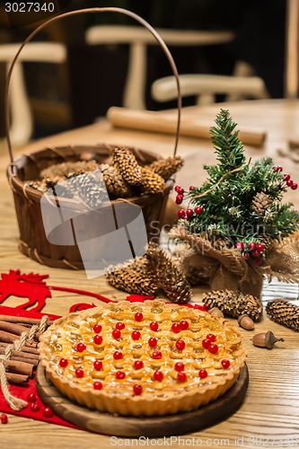 Image of Homemade christmas cake with wild berries.