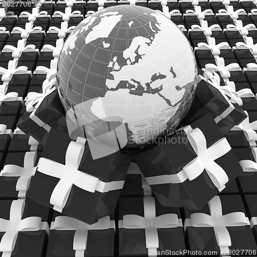 Image of Traditional Christmas gifts and earth. Global holiday concept 