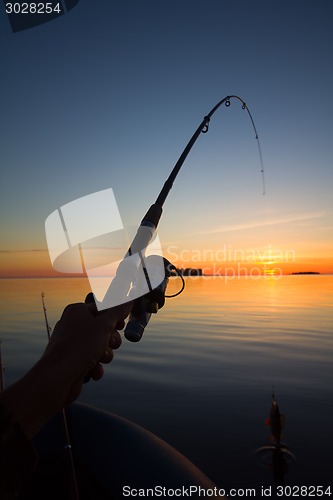 Image of Sunset river perch fishing with the boat and a rod