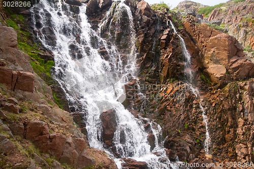 Image of big northern beautiful waterfalls on the seashore