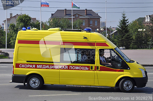 Image of Yellow ambulance car on the street of Tyumen.