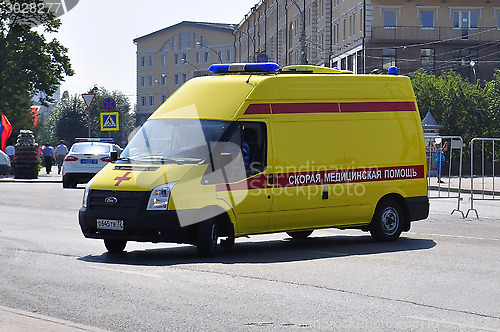 Image of Yellow ambulance car on the street of Tyumen.