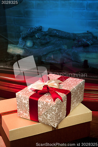 Image of Christmas gift box with red ribbon