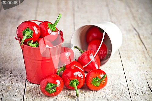 Image of red hot chilli peppers in little buckets