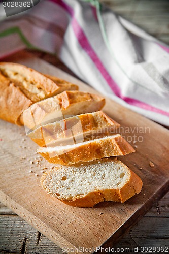 Image of french bread baguette and linen napkin