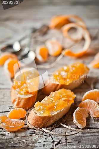 Image of pieces of baguette with orange marmalade 