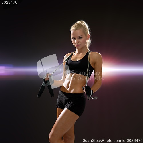 Image of sporty woman with skipping rope