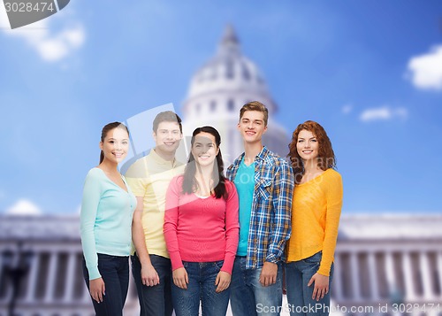 Image of group of smiling teenagers showing ok sign