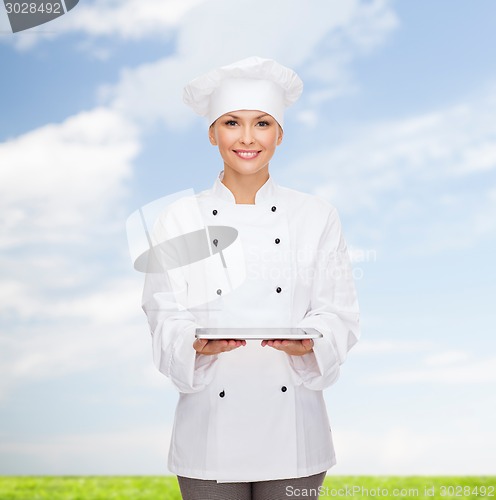 Image of smiling female chef with tablet pc computer