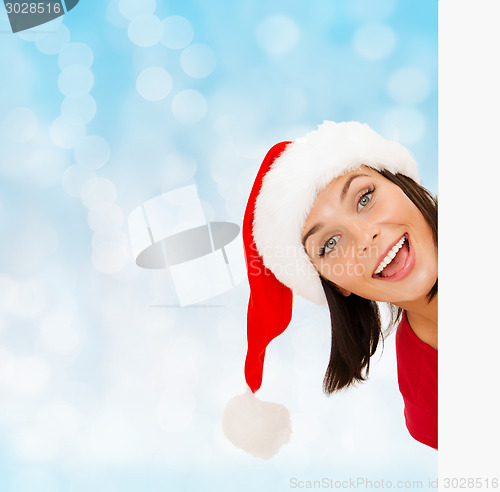 Image of woman in santa helper hat with blank white board