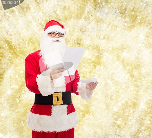 Image of man in costume of santa claus with letter