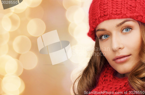 Image of close up of smiling young woman in winter clothes