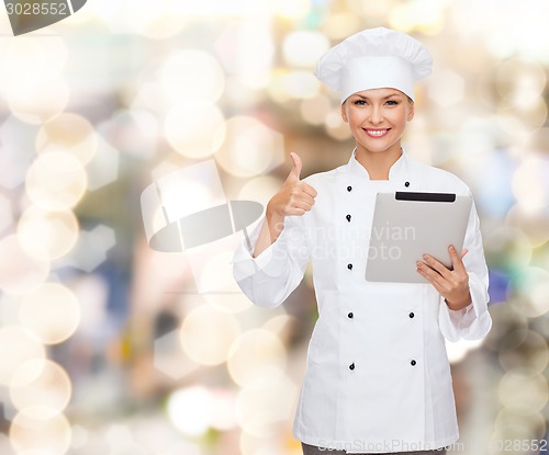 Image of smiling chef with tablet pc showing thumbs up
