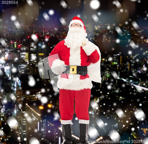 Image of man in costume of santa claus with bag