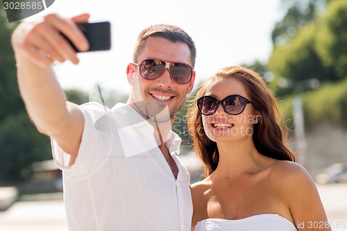 Image of smiling couple in city