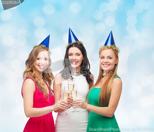 Image of smiling women holding glasses of sparkling wine