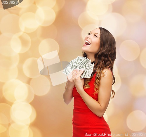 Image of woman in red dress with us dollar money