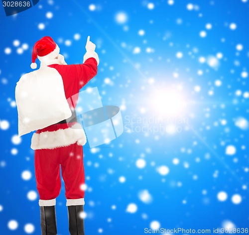 Image of man in costume of santa claus with bag