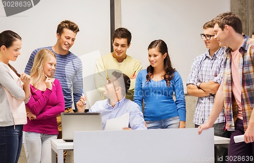 Image of group of students and teacher with laptop
