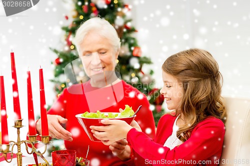 Image of smiling family having holiday dinner at home