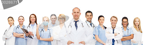 Image of group of smiling doctors with clipboard