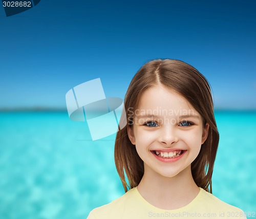 Image of smiling little girl over white background