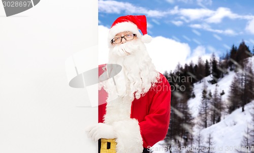 Image of man in costume of santa claus with billboard