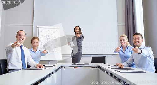 Image of group of businesspeople pointing finger at you
