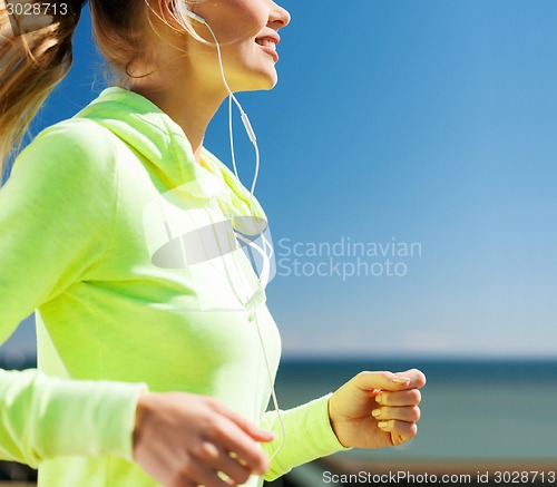 Image of woman running outdoors