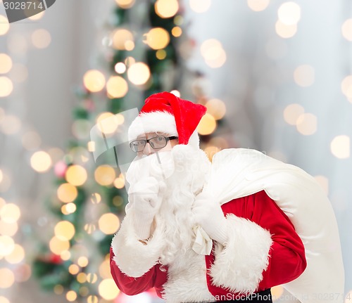 Image of man in costume of santa claus with bag