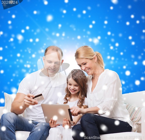 Image of happy family with tablet pc and credit card