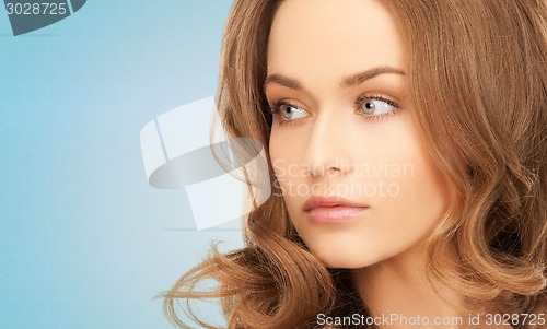 Image of beautiful young woman with bare shoulders