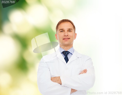 Image of smiling male doctor in white coat