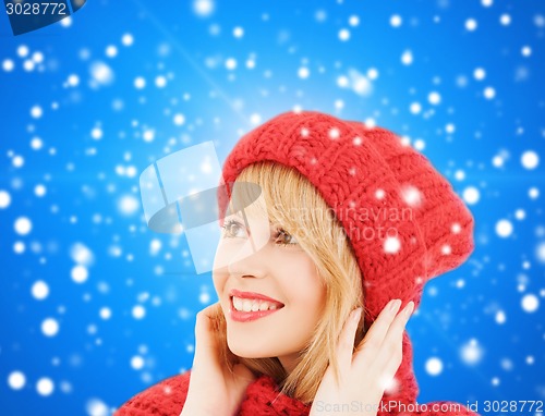 Image of smiling young woman in winter clothes