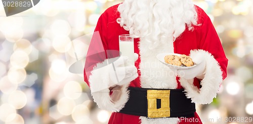 Image of santa claus with glass of milk and cookies