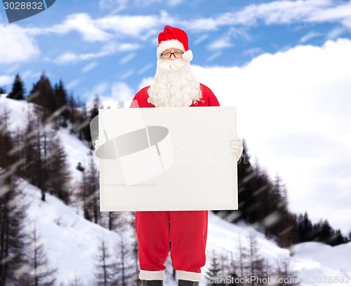 Image of man in costume of santa claus with billboard