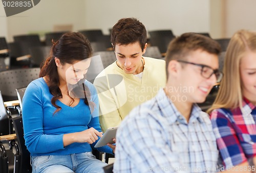 Image of group of smiling students with tablet pc