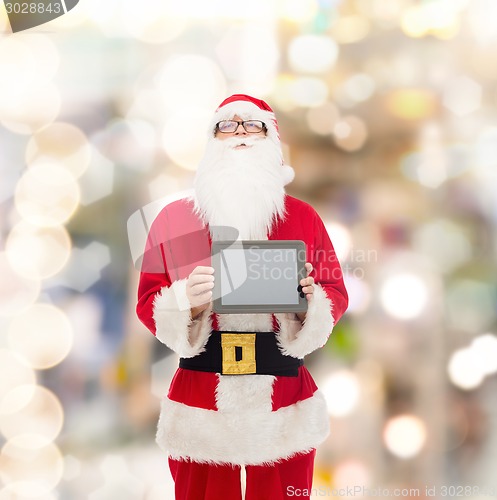 Image of man in costume of santa claus with tablet pc